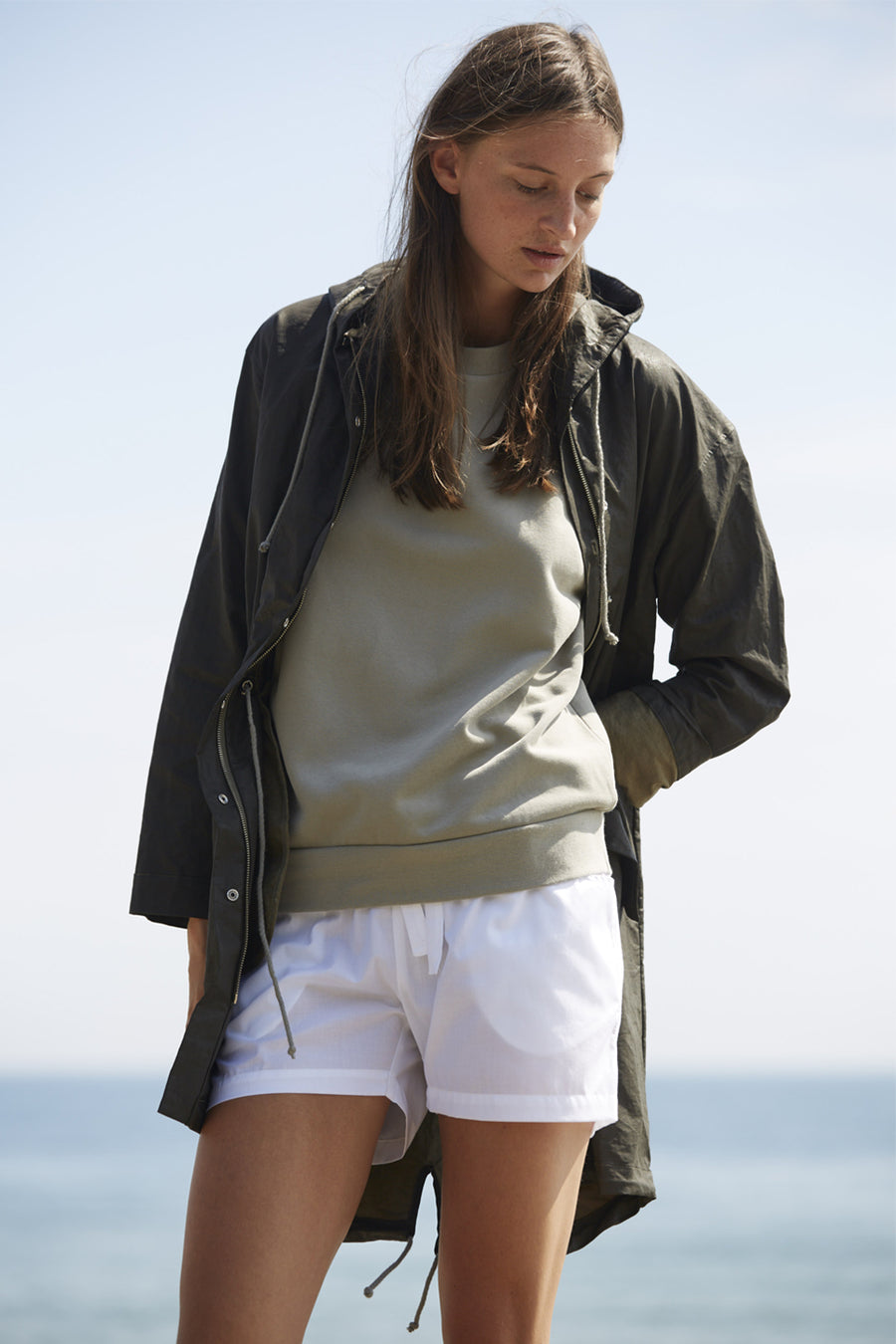 Water resistant jacket for women with hood made from a recycled organic cotton linen in dark khaki