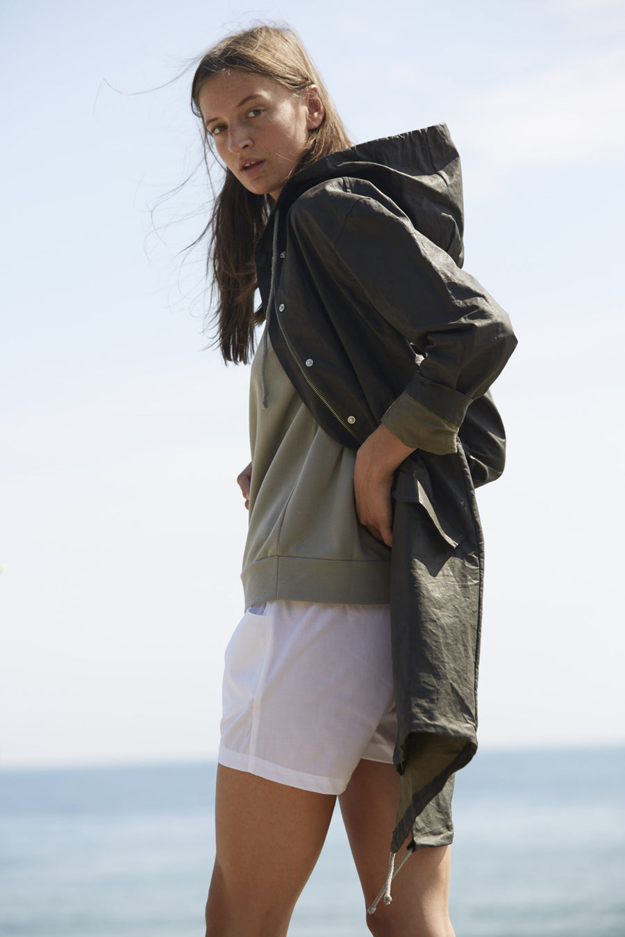 Water resistant jacket for women with hood made from a recycled organic cotton linen in dark khaki