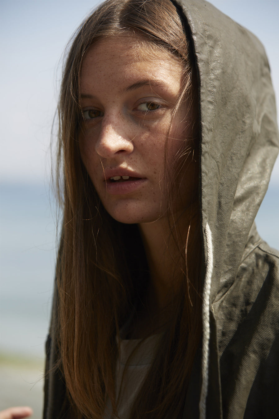 Water resistant jacket for women with hood made from a recycled organic cotton linen in dark khaki